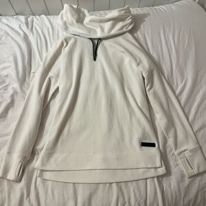 A small cream turtleneck fleece pullover from calvin Klein